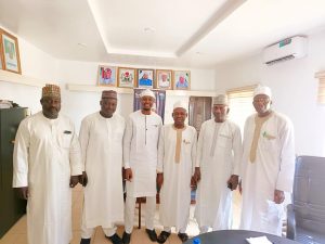 Middle, Bashir Yakubu Harka, DG. Niger State Housing Corporation, in a group photography during his assumption of office