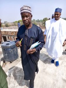 The Executive Chairman Niger State Universal Basic Education Board on white .... Inspecting projects